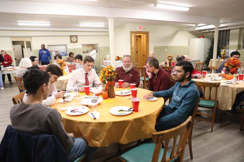 a group of people sitting at a table