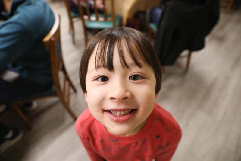 a child smiling at the camera