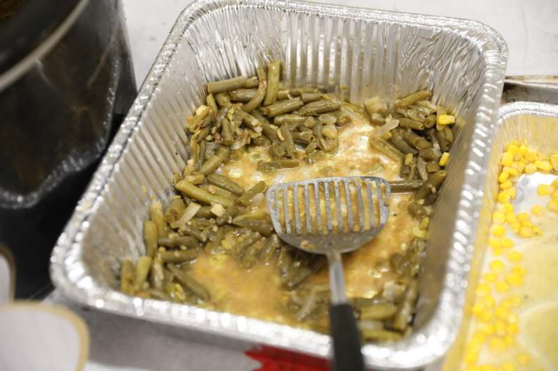 a metal tray with food in it