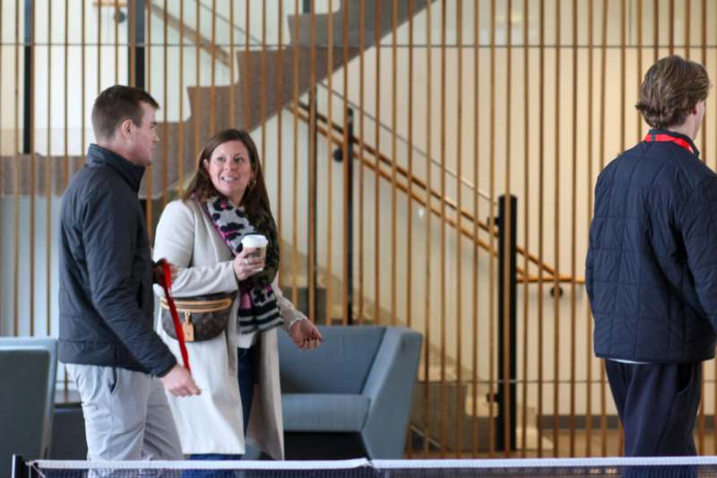a group of people walking in a building