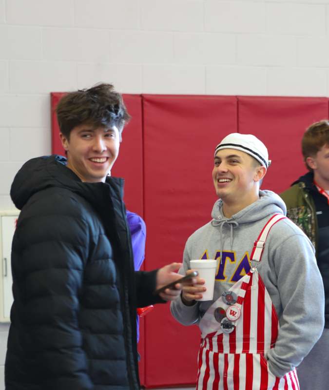 a man smiling at another man