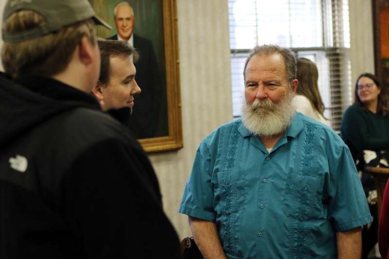 a man with a beard and a man with a beard and a man with a beard