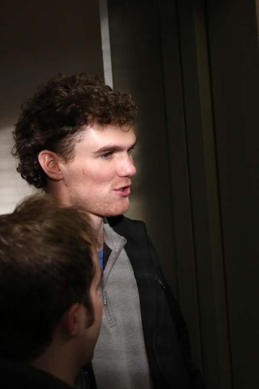 a man looking at another man