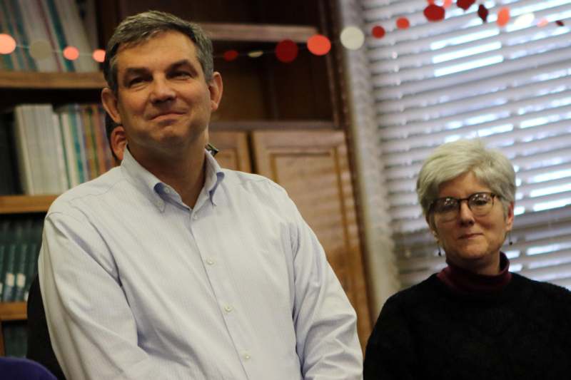 a man and woman sitting in a room