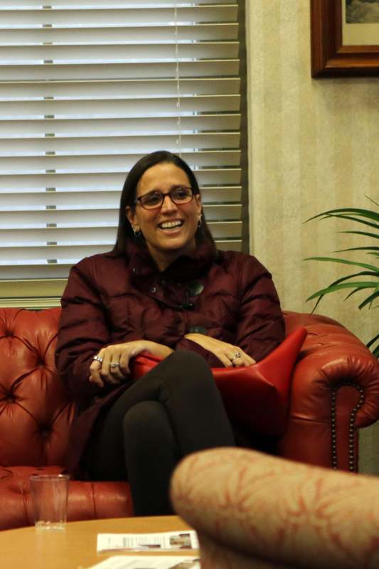 a woman sitting on a couch