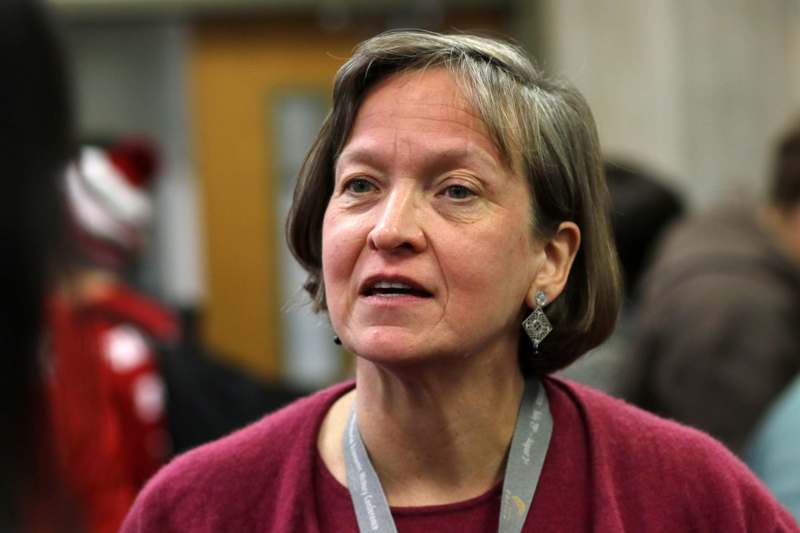 a woman wearing a lanyard