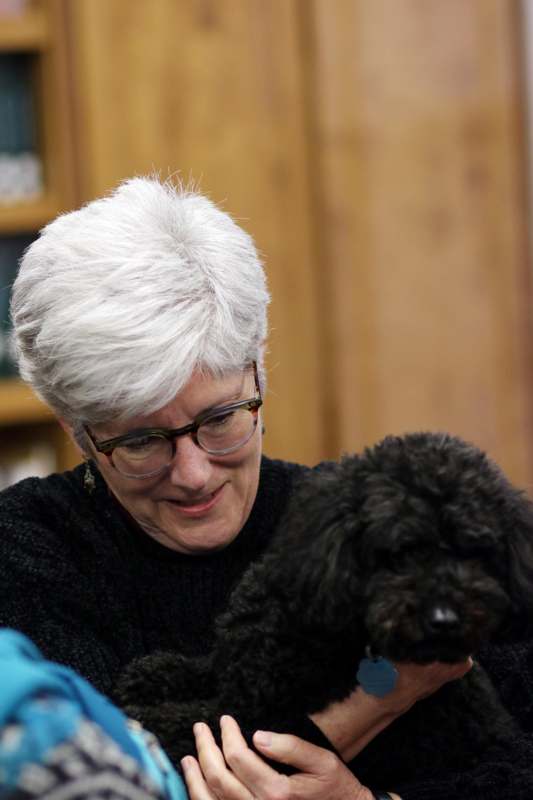 a woman holding a dog