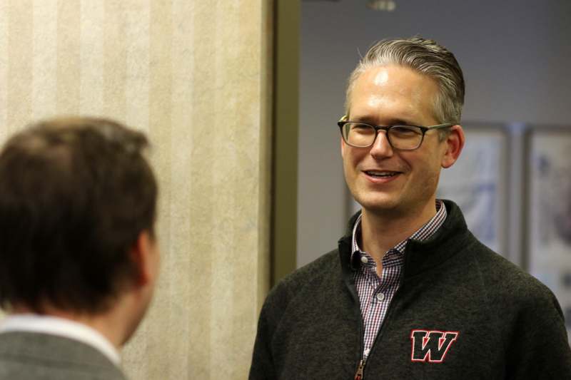 a man in a black sweater