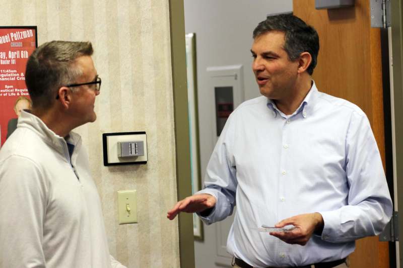 a group of men talking to each other
