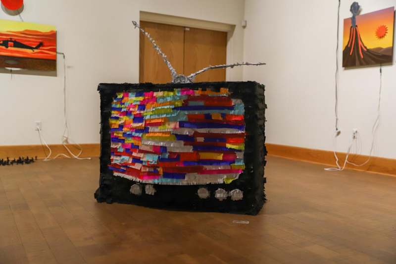 a pinata made of colorful strips of paper