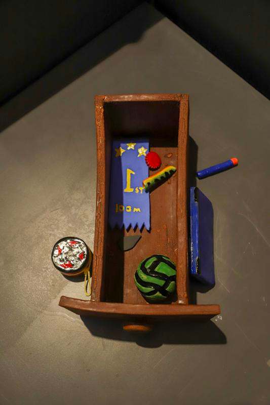 a wooden box with objects in it