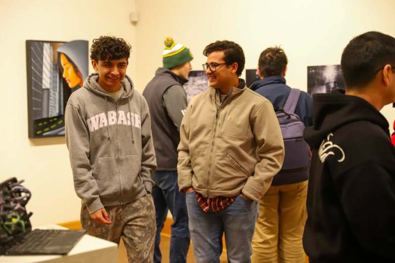 a group of men standing in a room