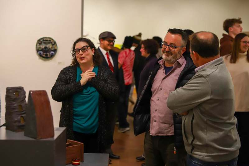 a group of people standing in a room