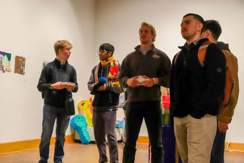 a group of men standing in a room