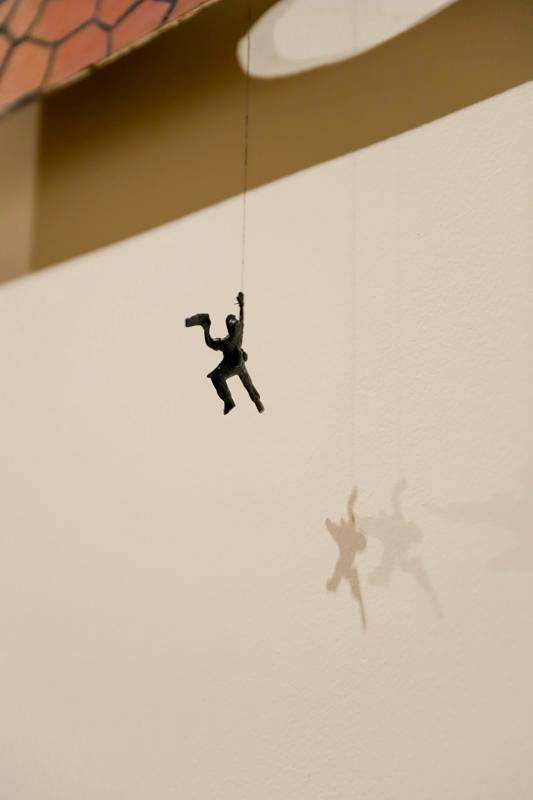 a toy figurine from a string