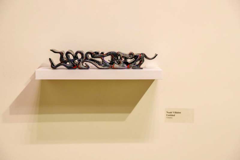 a sculpture on a shelf