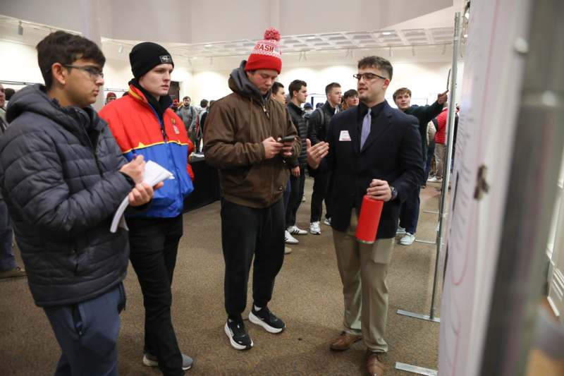 a group of people standing in a room