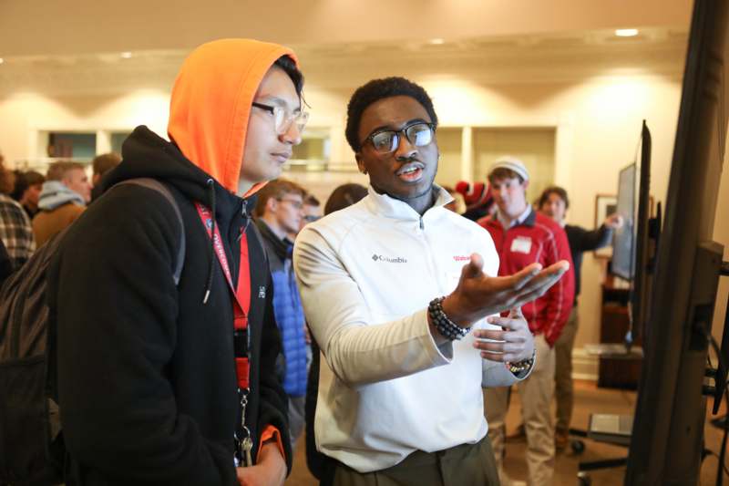 a group of people standing in a room
