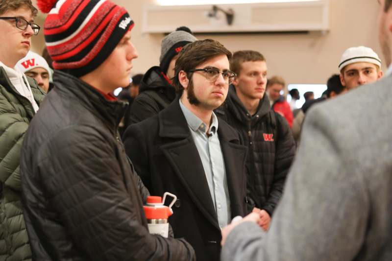a group of men standing in a line