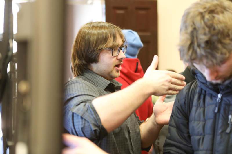 a man talking to another man