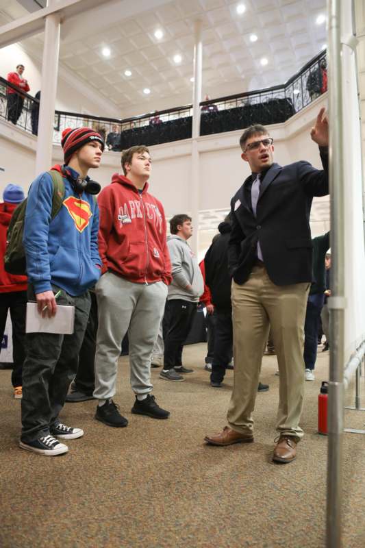 a man pointing to a group of people