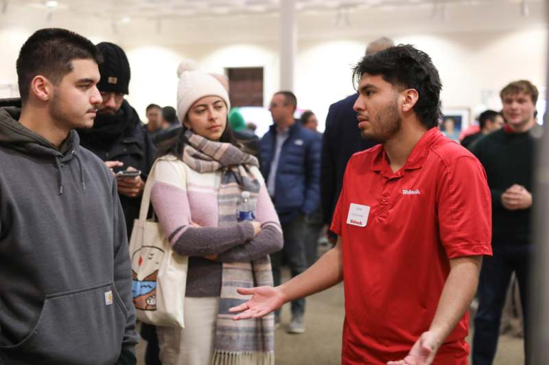 a group of people standing in a room