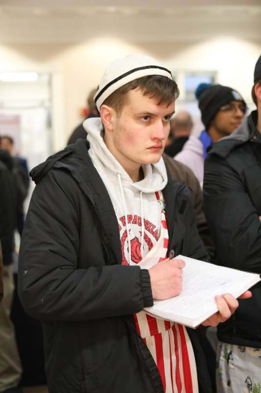 a man holding a notebook