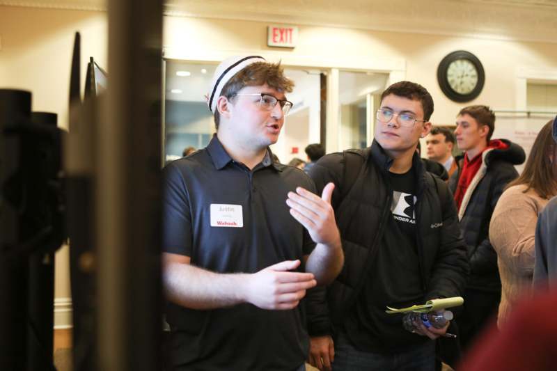 a group of men standing in a room