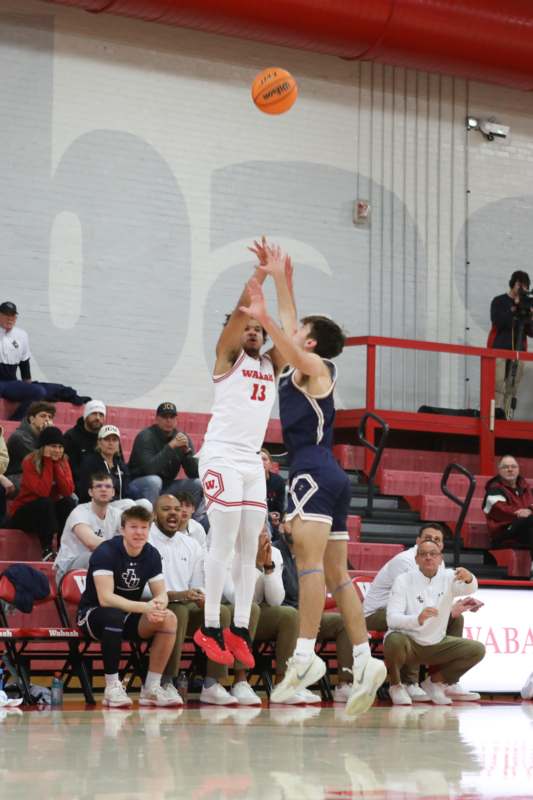 a group of men playing basketball