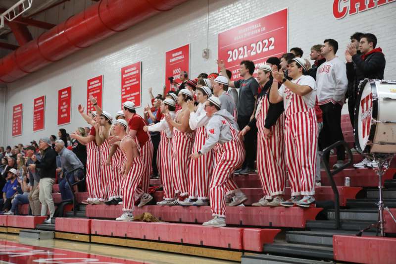 a group of people in striped overalls