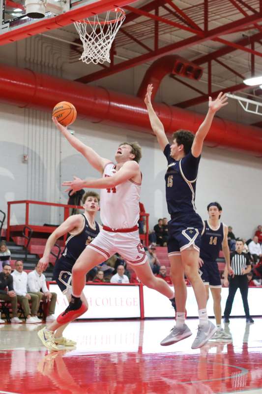 a group of men playing basketball