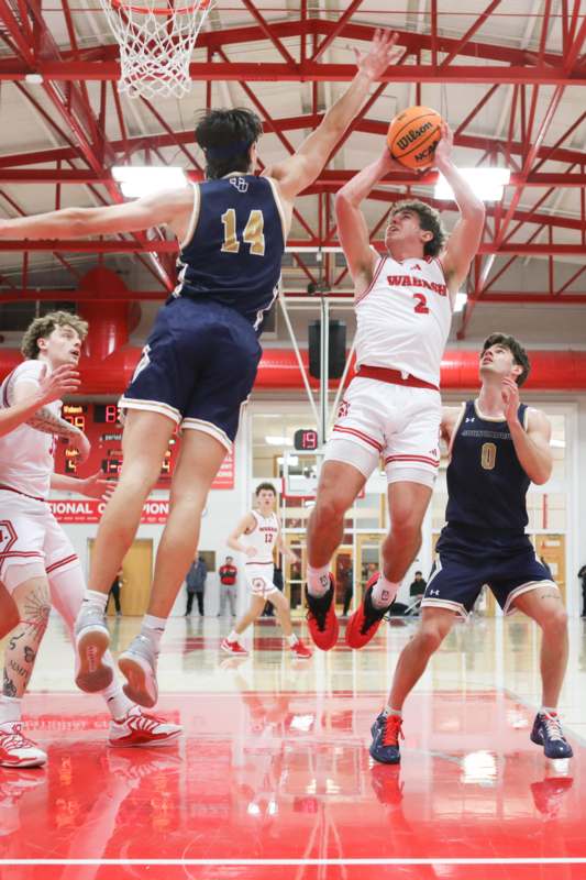 a group of men playing basketball