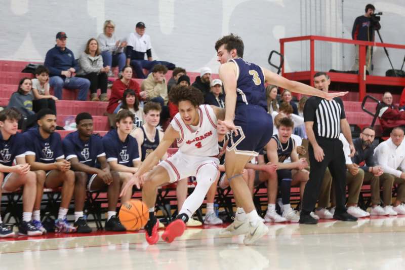 a basketball player chasing a basketball