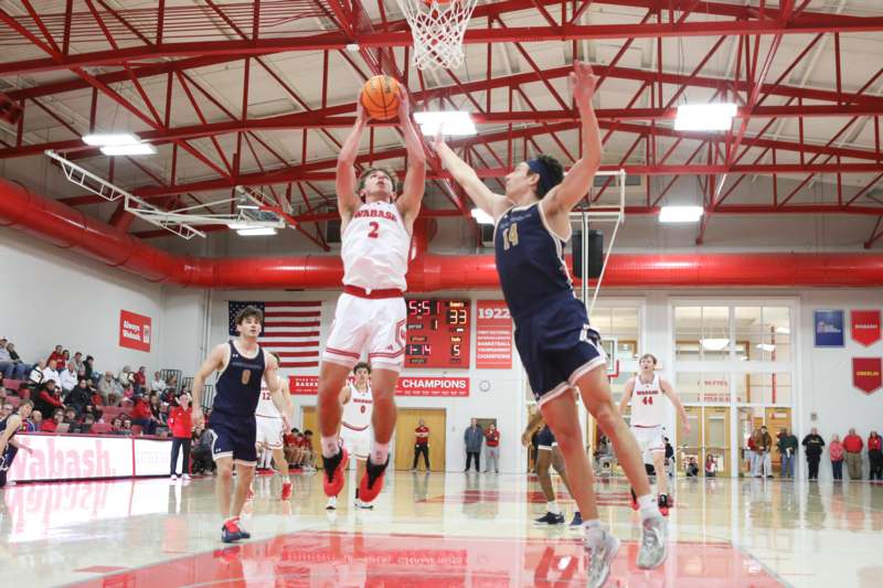 a group of men playing basketball
