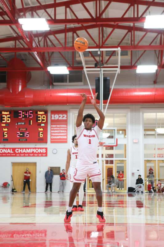 a man in a white uniform jumping to shoot a basketball