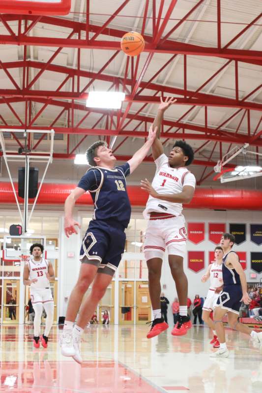 a group of men playing basketball