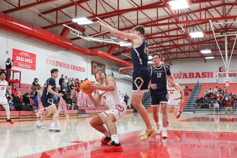 a group of men playing basketball