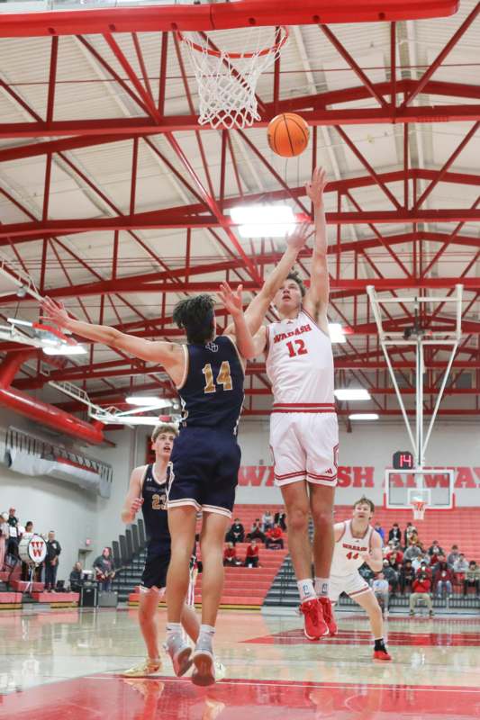 a group of men playing basketball