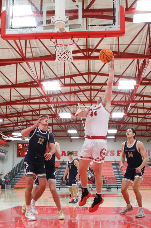 a group of men playing basketball