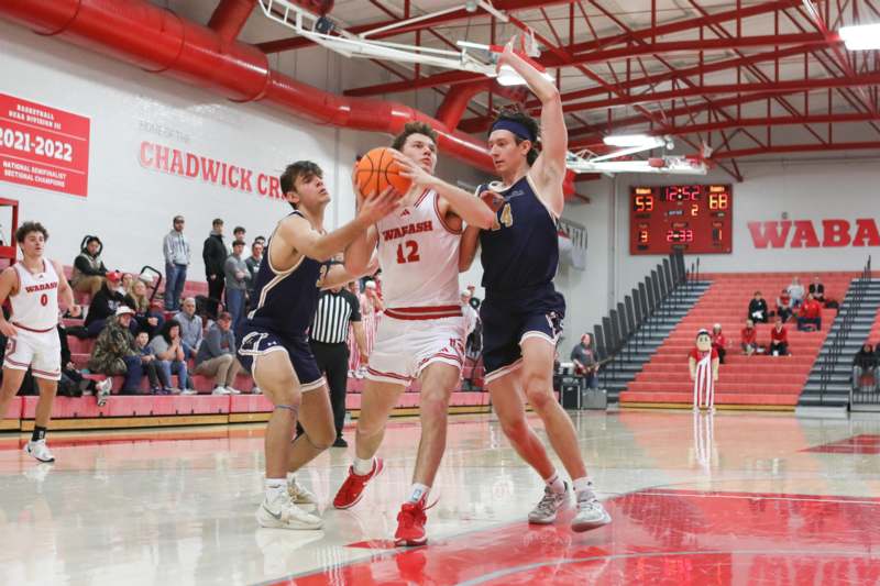a group of men playing basketball