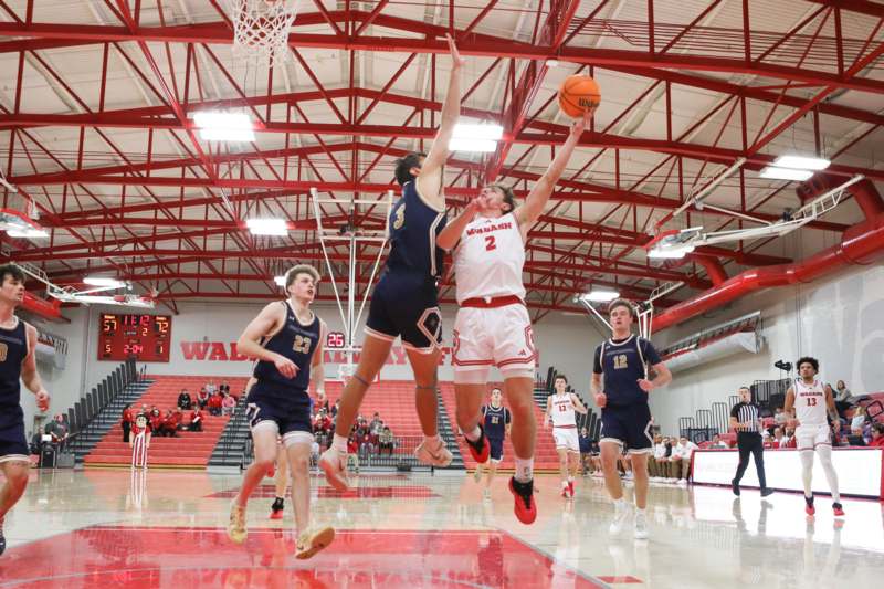 a group of men playing basketball