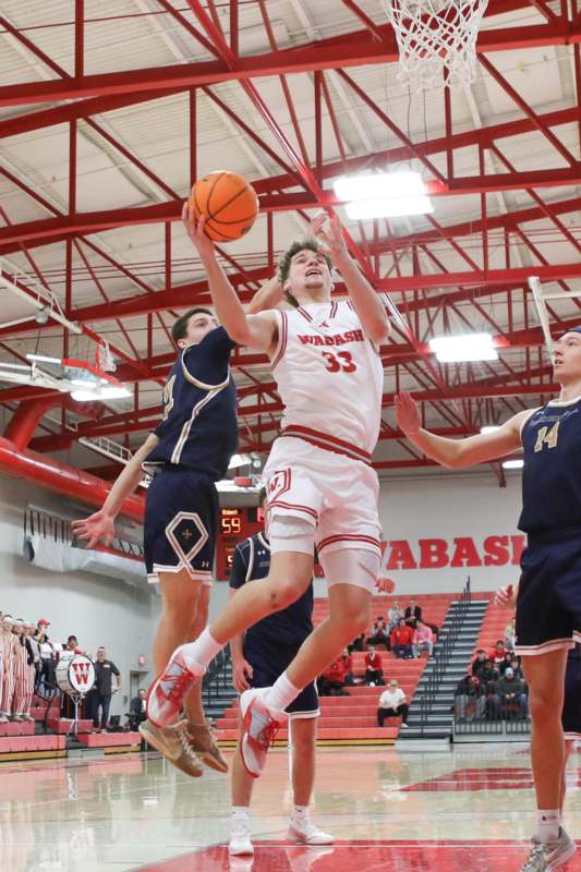 a group of people playing basketball