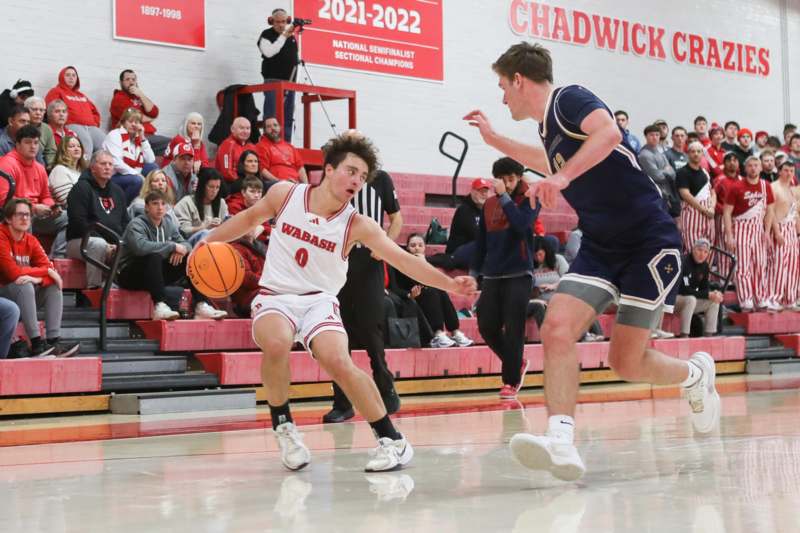 a group of men playing basketball