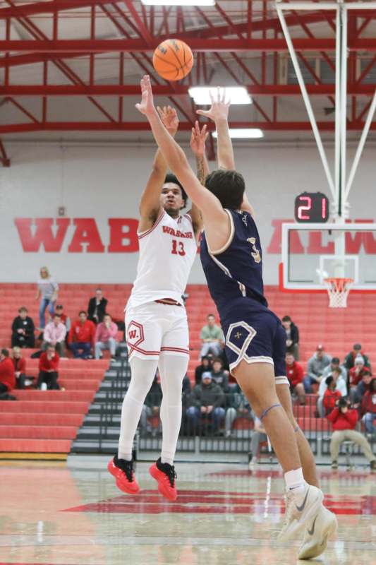 a basketball player reaching for a shot
