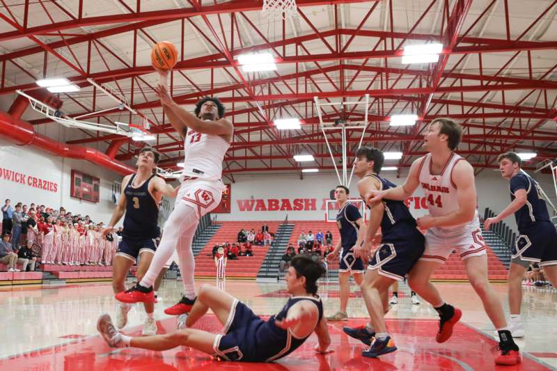 a group of men playing basketball