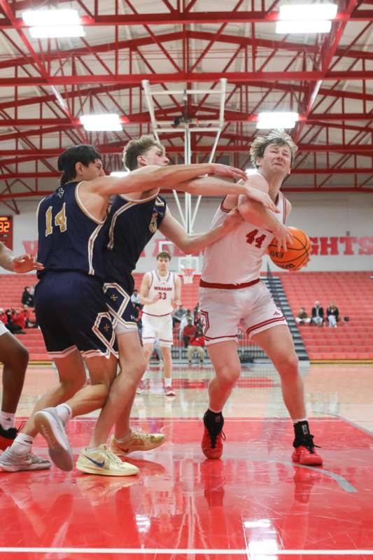 a group of people playing basketball
