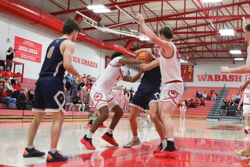a group of men playing basketball