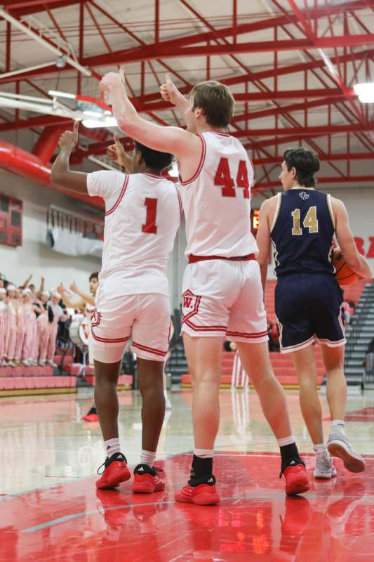 a group of men in uniform in a gym