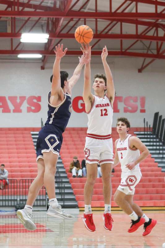 a group of men playing basketball