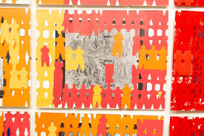 a group of cut out paper people